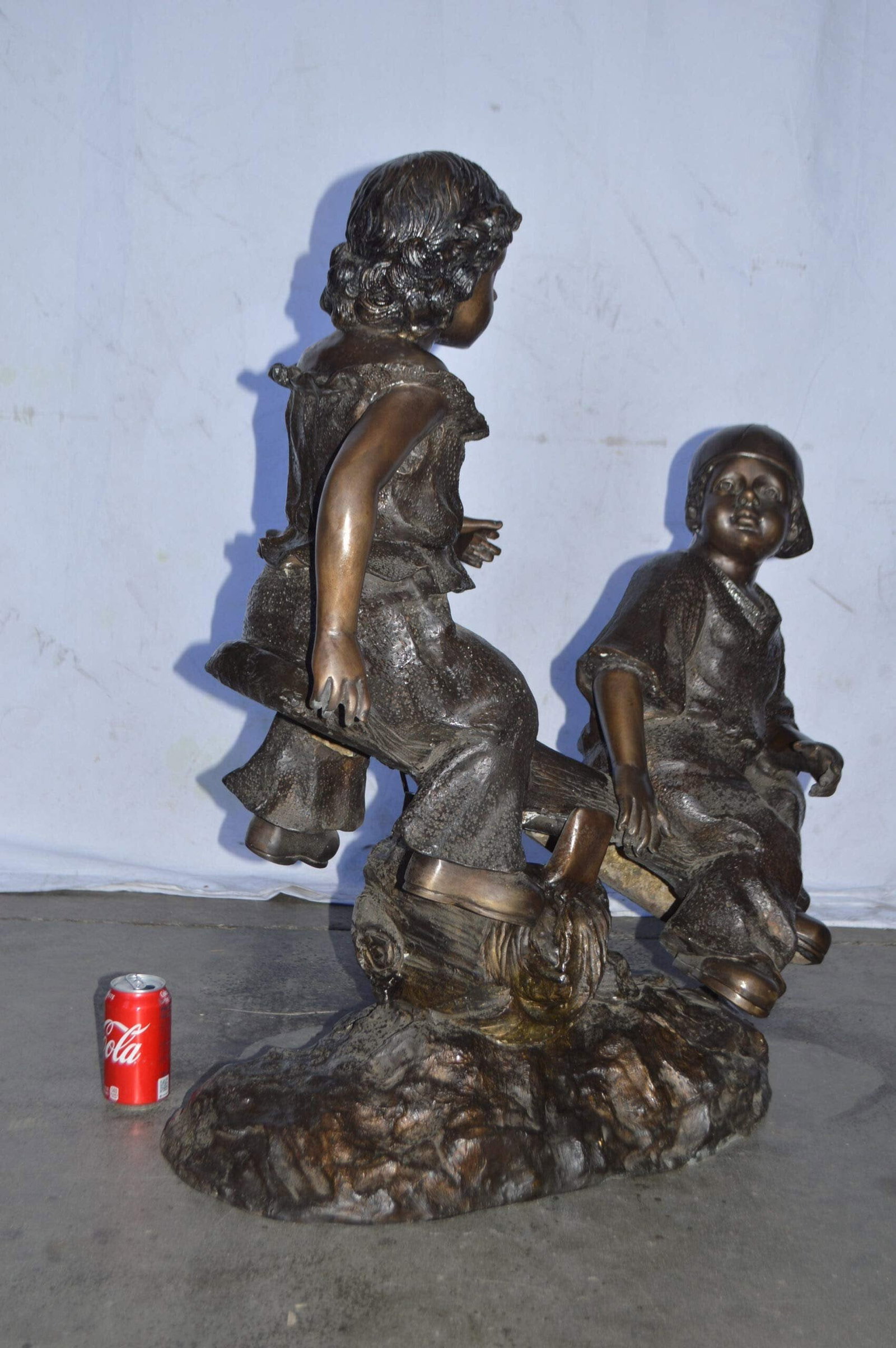 A Boy and a Girl Playing Seesaw Bronze Statue - Size: 17"L x 33"W x 36"H. - 7
