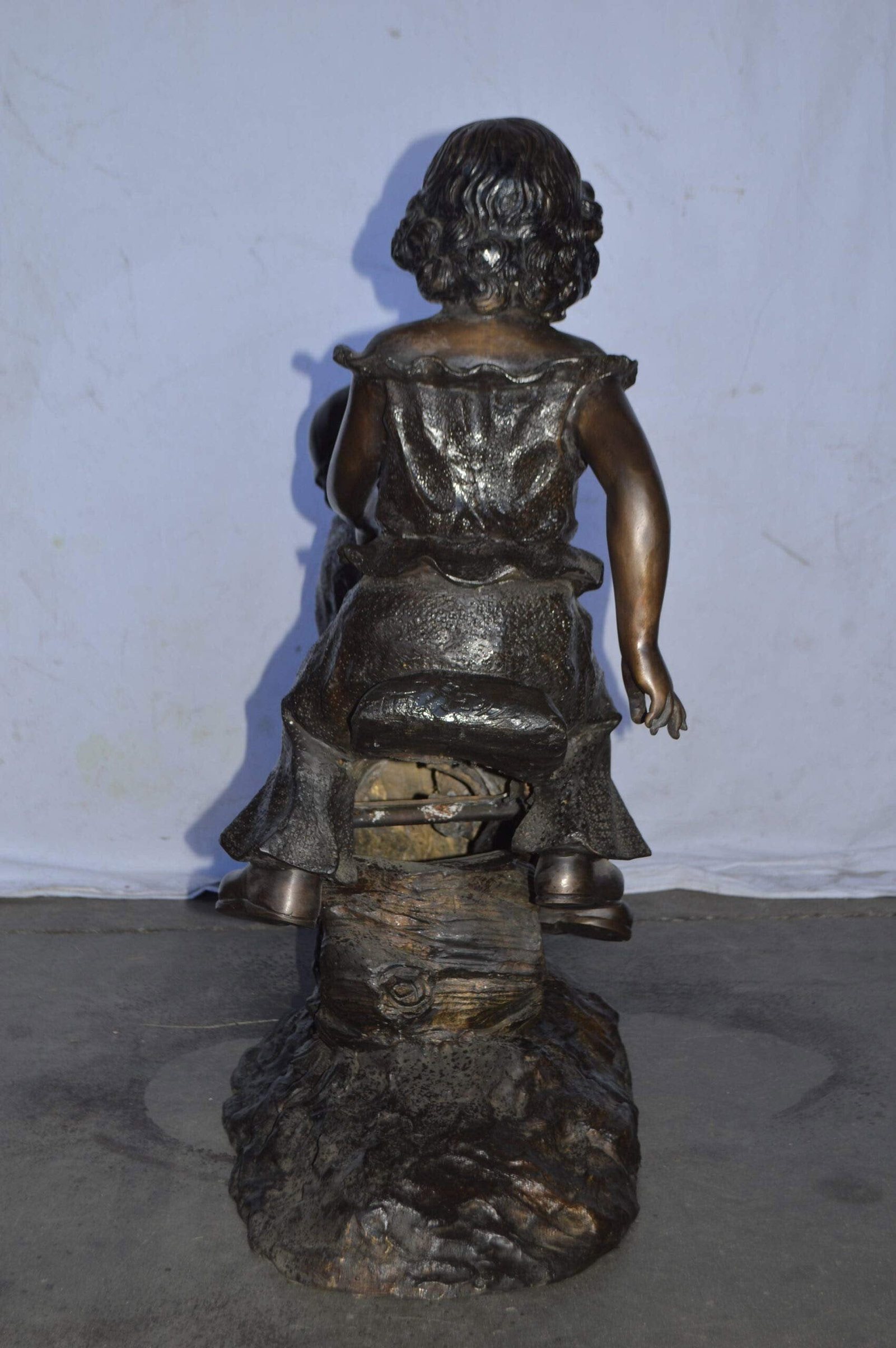 A Boy and a Girl Playing Seesaw Bronze Statue - Size: 17"L x 33"W x 36"H. - 8
