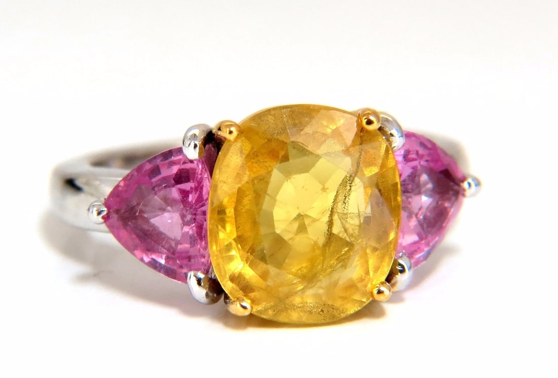 6.55ct Natural yellow sapphire ring 14kt *v: Natural Yellow Sapphire diamonds ring. 4.45ct. Natural yellow Sapphire 4.59 X 8.97 x 10.06mm Full cut cushion brilliant Semi Clean Clarity & Transparent 2.10 natural (2) pink sapphires on sides Clean 