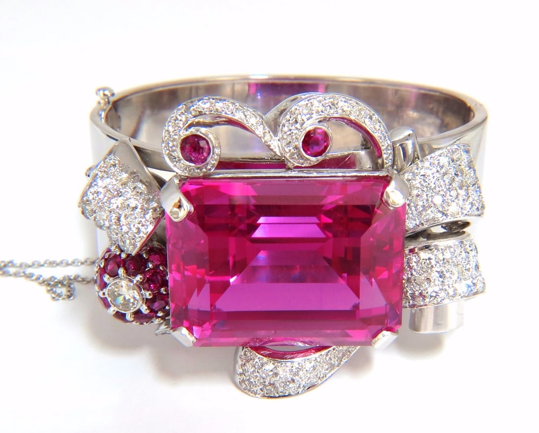 GIA Lab Pink Sapphire Diamonds Ruby Bangle Bracelet Parisian Posh Deco**: Parisian Pink Posh 142.94ct Synthetic pink sapphire bangle bracelet. Pink, Transparent & Emerald cut. 30.89 x 24.25 x 18.20mm 3.30ct. natural diamonds: Rounds, G color Vs-2 clarity. Additional 2.25ct 
