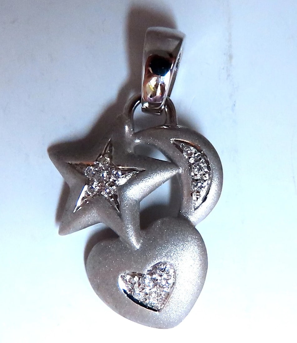 .24ct Heart stars moon Natural diamonds pendant 18 karat**: Loves & Sparkles. .24ct. Natural diamonds heart star moon necklace. Full cut and Brilliant G-color, Vs-2 clarity Pendant Measurements: 18 x 30mm Total 6 grams 18kt. white gold. Free Insured overnight
