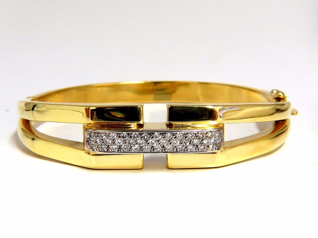 bangle bracelet 14kt .70ct round natural diamonds raised bar mod deco**: Mod Elegant. .70ct. Natural diamonds bangle bracelet. Bead set, smooth & clean finish. Round, Full cuts, H color Vs-2 clarity. 14kt. yellow gold 18.6 Grams. .53 inch wide Made for 7 inch wrist safety 