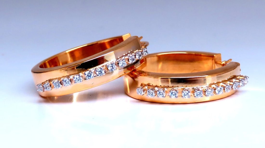 14kt gold zircon hoop lever earrings**: Round Hoop zircon earrings. 14 karat yellow gold 5 grams 25 mm wide front to back 6 mm thick at Diamond row Lever Clip release ....*. Reserve: $465.00 Shipping: Domestic: Free shipping to anywhere