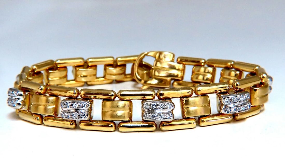 .80ct Natural Masculine Mod Durable Hinged Bracelet 14 Karat**: Masculine Mod Hinged Rectangular Micro-set. .80ct. natural diamonds. Rounds, Full cut brilliants G colors Vs-2 clarity. 14kt. white / yellow gold 29.6 Grams. 7 Inches long (wearable length) 9.8mm