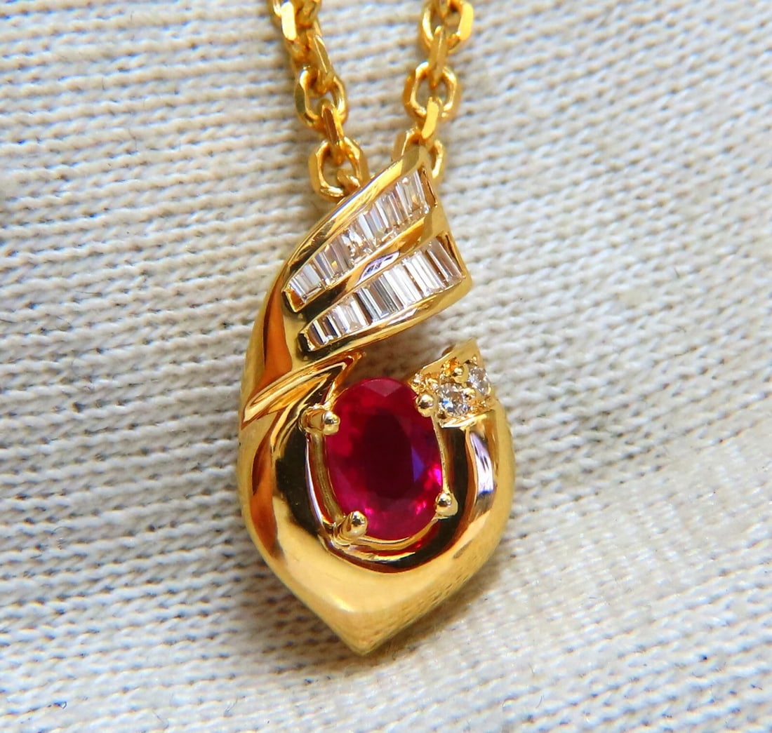 .91ct Natural Oval Ruby & Diamonds Necklace 14 Karat **: Red Ruby & Diamonds Necklace .65ct. natural oval ruby Vivid Red .25ct. Natural diamonds. Baguette Cuts G color Vs-2 clarity 14Kt yellow gold 9 grams. Overall: 18.5 x 10.3mm Necklace Overall length: 20