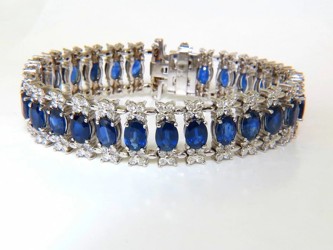33.75CT NATURAL GEM SAPPHIRE DIAMOND BRACELET 3 ROW & WIDE CUFF 14KT**: 28.00ct. Natural Sapphires vivid royal blue transparent and full cut ovals clean clarity 5.75ct. Diamonds Brilliant Cuts. G-color, Vs-2 clarity 14kt. White gold 42.9 grams. 7 inches long 15.6mm wide S