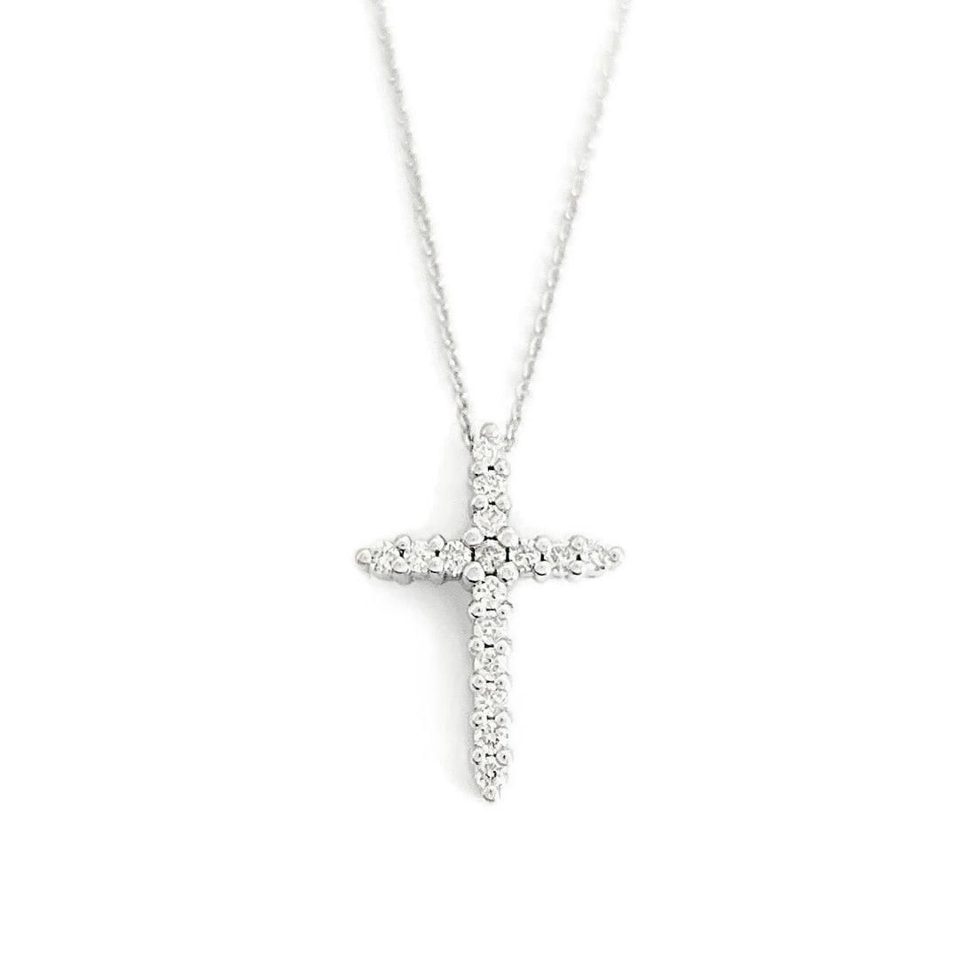 Small Diamond Cross Religious Pendant Necklace 14K White Gold .16 CTW: Small Diamond Cross Religious Pendant Necklace 14K White Gold .16 CTW This is a beautiful diamond cross necklace. Please let us know if you have any questions. Diamonds: 16 round brilliant cuts .16