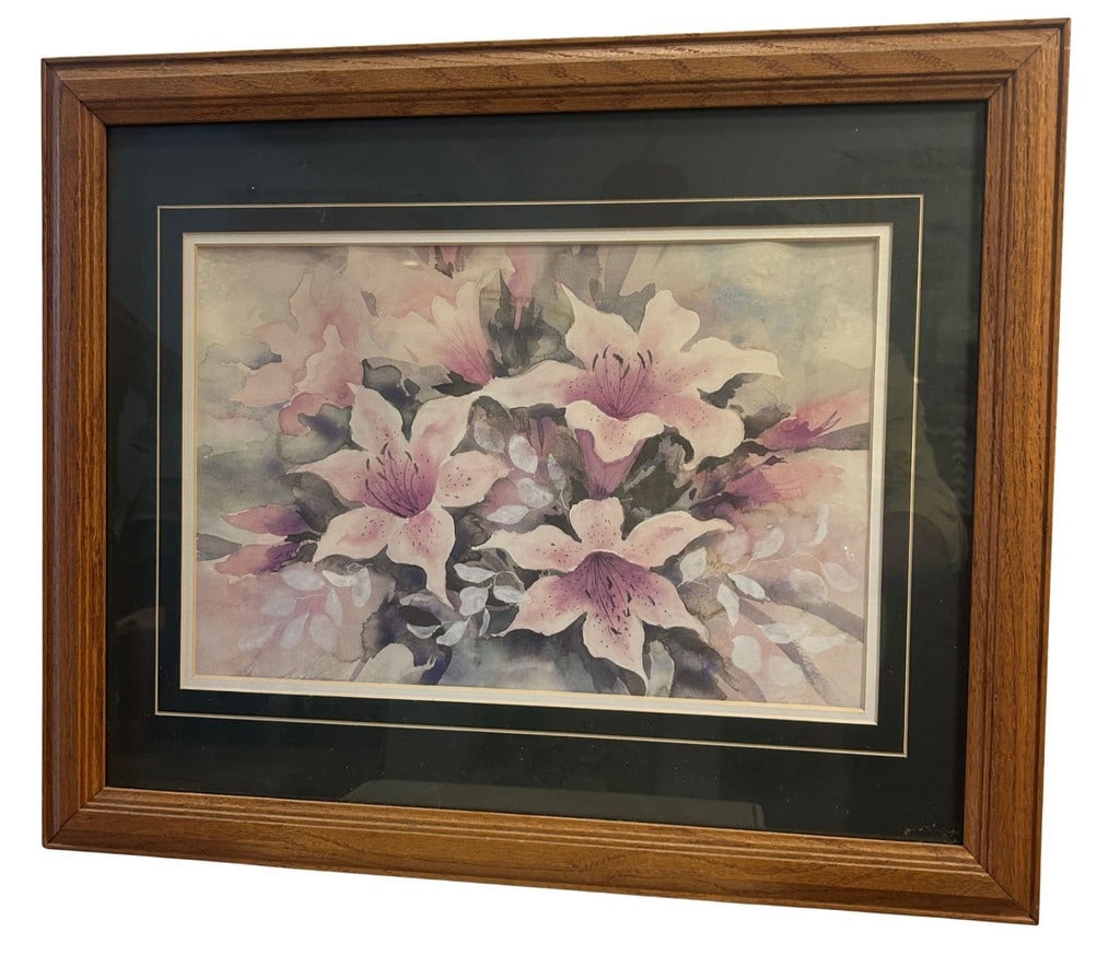 Floral Arrangement Watercolor Signed and Dated: This charming watercolor depicts a delicate floral arrangement, likely lilies or similar blossoms, in soft hues of pink, purple, and green. The style suggests a contemporary decorative piece,