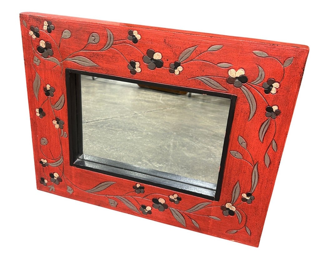 Folk Art Hand-Painted Red Floral Wall Mirror: This charming wall mirror features a vibrant red frame adorned with hand-painted floral motifs in black, white, and gray. The distressed finish gives it a rustic or shabby-chic appeal. The mirror is f