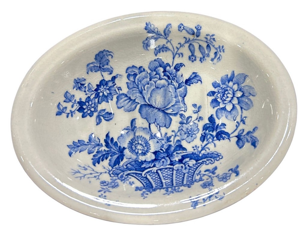 Royal Staffordshire â€œTonquinâ€? Pattern Oval Dish: This charming oval dish, crafted by Royal Staffordshire, features the distinctive "Tonquin" pattern. The dish is adorned with an intricate transferware design in classic blue and white, depicting a