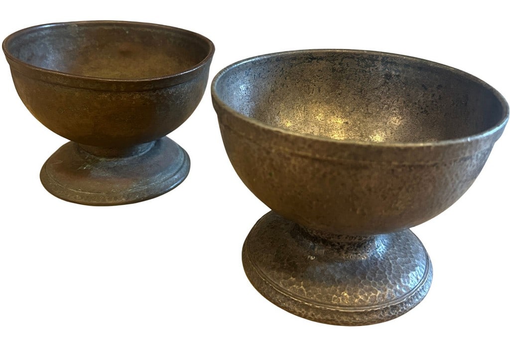 Pair of 19th Century Joseph Henrichs & Corps. Hammered Silver Soldered Metal Chalices/Goblets: A pair of Arts and Crafts style chalices or goblets, crafted from hammered silvered metal. Excellent patina. Maker's marks indicate Jos. Henrichs Corporation, made in New York. Silver-soldered. YORK