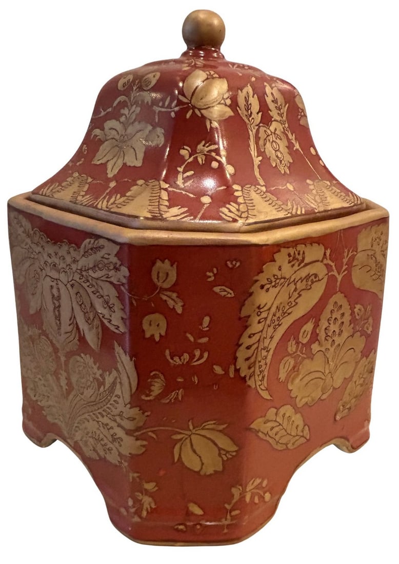 Chinoiserie Style Red and Gilt Octagonal Covered Jar: This octagonal covered jar is crafted in a Chinoiserie style, featuring a rich red ground adorned with extensive gilt decoration. The ornate floral and foliate motifs are inspired by East Asian aesthe
