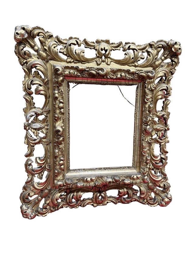 Early 20th Century Baroque Style Giltwood Carved Frame: A fine likely European early 20th century Baroque style carved figural frame, with carvings of vegetal themes. Picture frame size is 8.5" x 6.75". Dimensions: Height 18.5, Width 16.5, Depth inches Wei