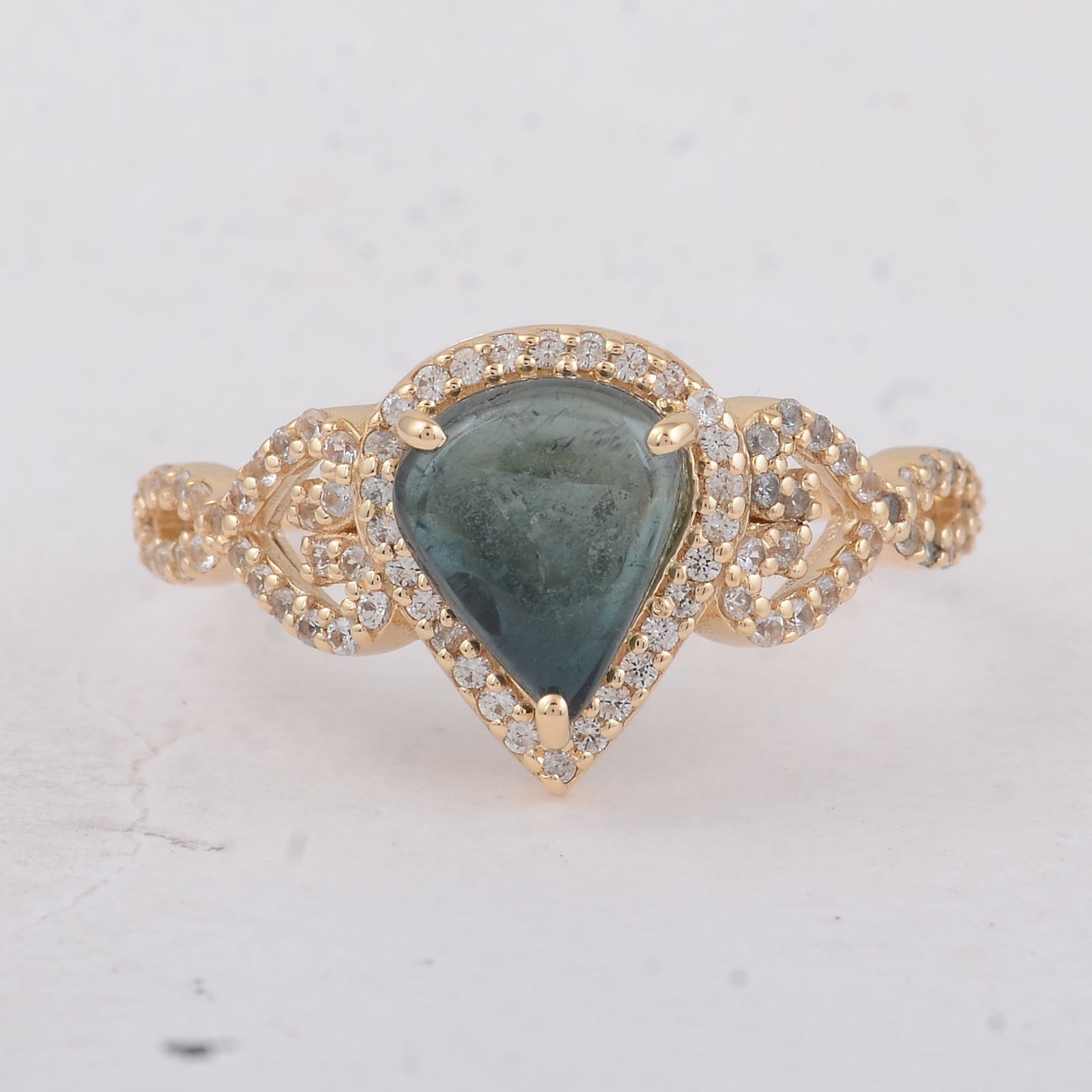 1.84 Ct Pear Tourmaline 9K Gold Ring: 1.84 Total Carat Tourmaline 9K Gold Ring Specifications: Total Weight 2.18 g Center Gemstone Tourmaline Gemstone Carat Weight 1.49 Carats Gemstone Measurements 8.30X7X3.10 mm Additional Gemstones Whit