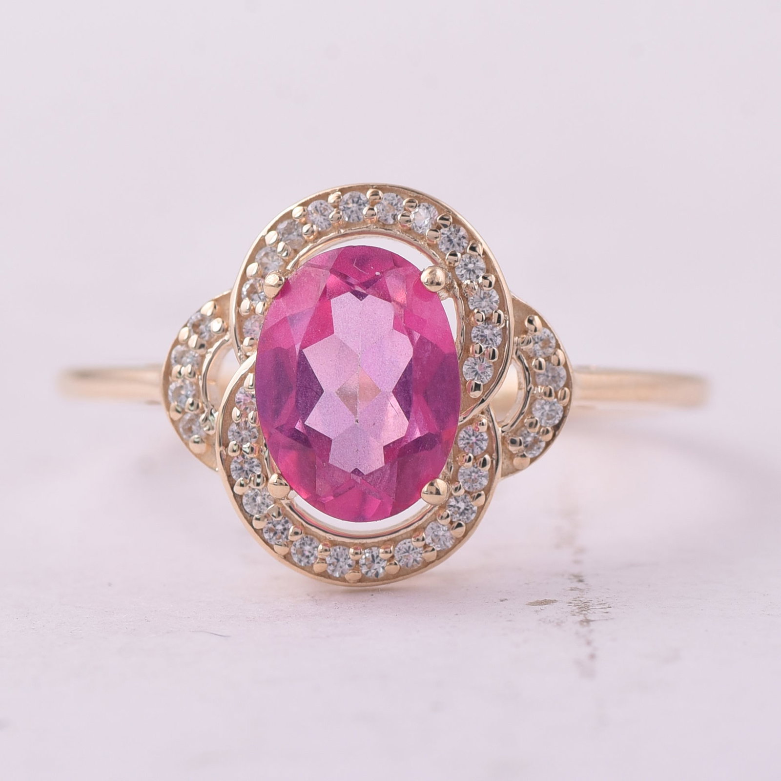 1.48 Ct Oval Pink Topaz 9K Gold Ring: 1.48 Total Carat Pink Topaz 9K Gold Ring Specifications: Total Weight 1.855 g Center Gemstone Pink Topaz Gemstone Carat Weight 1.33 Carats Gemstone Measurements 8X6 mm Additional Gemstones White