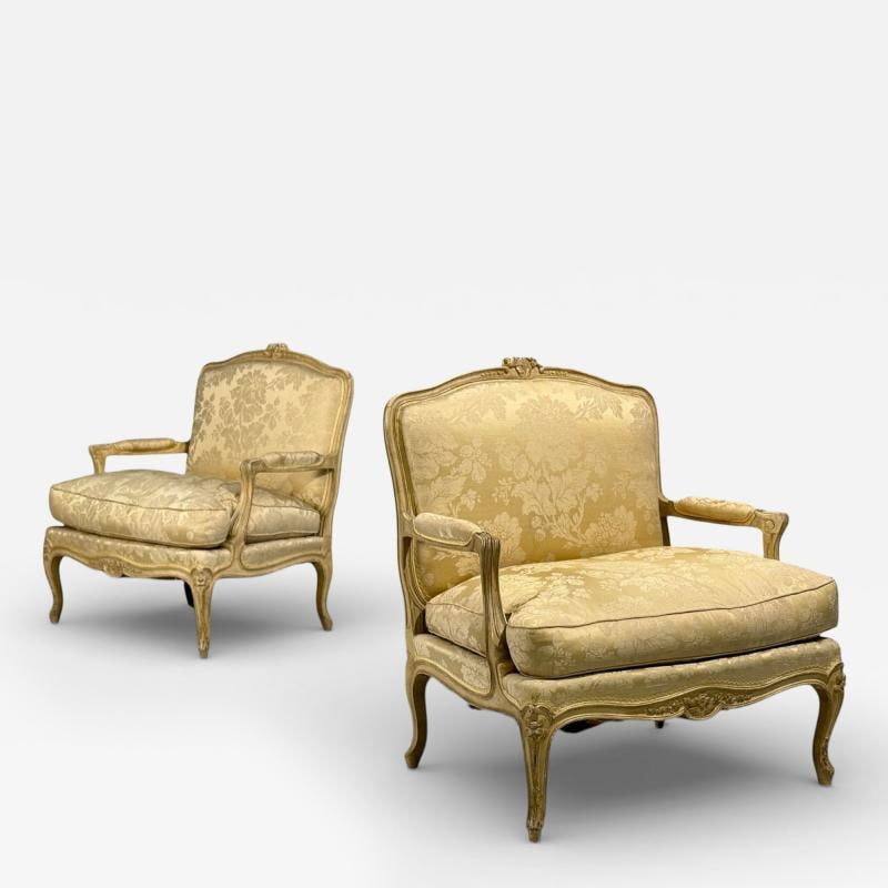 Maison Jansen, Louis XVI Armchairs, Giltwood, Fabric, France, 20th c.: Title: A pair of Louis XV style lounge chairs by Maison Jansen in their original fabric. A finely carved pair of chairs having a distressed finish with open side arms. Each in a clean floral designed 
