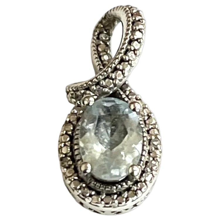 Estate Sterling Silver Oval Cut Aquamarine Halo Pendant: Title: Estate Sterling Silver Oval Cut Aquamarine Halo Pendant Description: Estate Sterling Silver Oval Cut Aquamarine Halo Pendant. Hallmarked: 925 SUN. Weighs 1.8 grams . Measures Approx. .75 x .30