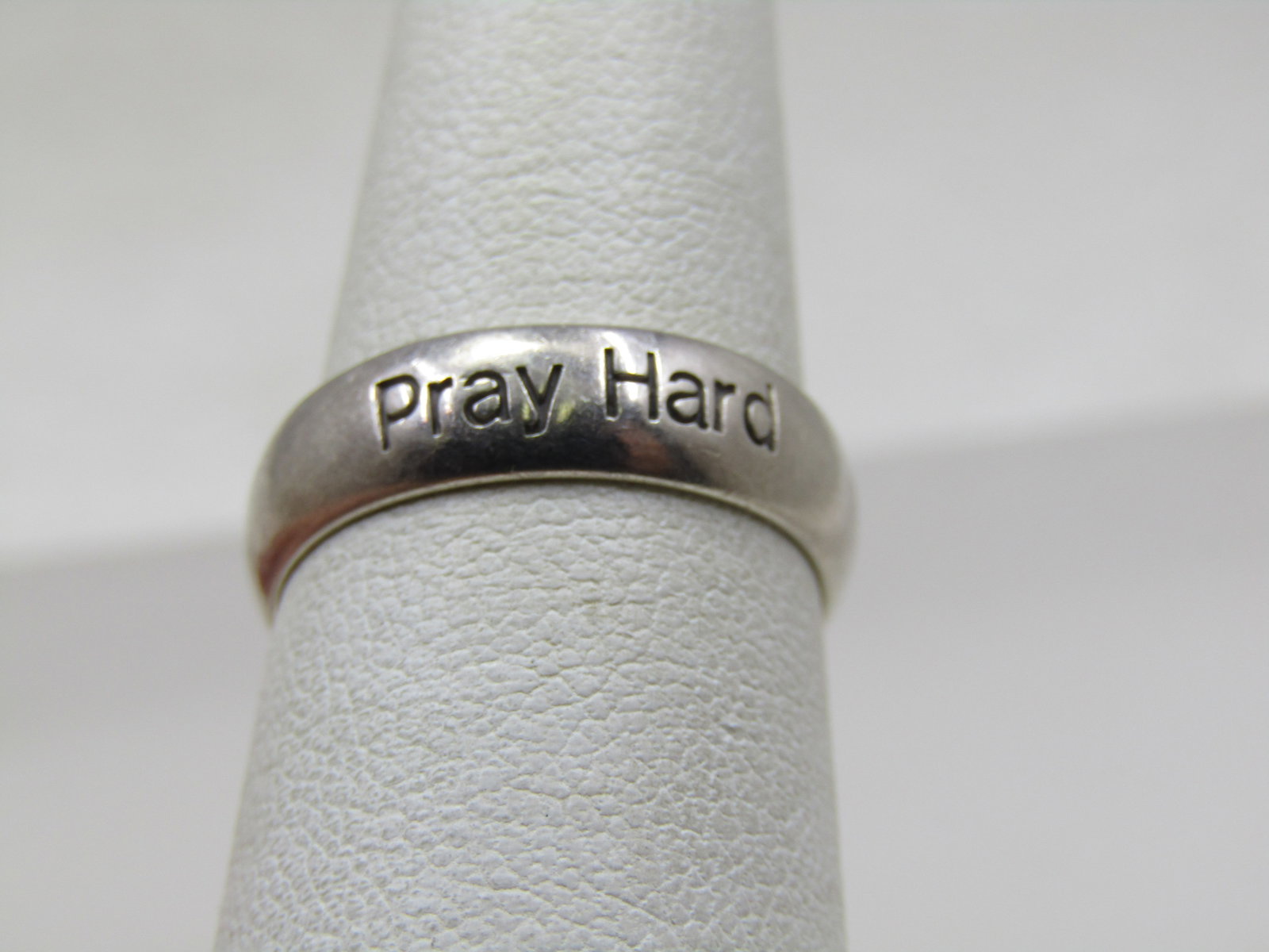 Vintage Sterling Pray Hard Ring, Wedding Band, Sz. 7: Title: Vintage Sterling Pray Hard Ring, Wedding Band, Sz. 7 Description: Vintage Sterling Pray Hard Ring, Wedding Band, Sz. 7. It is 5mm wide with Pray Hard engraved in the band in one place that