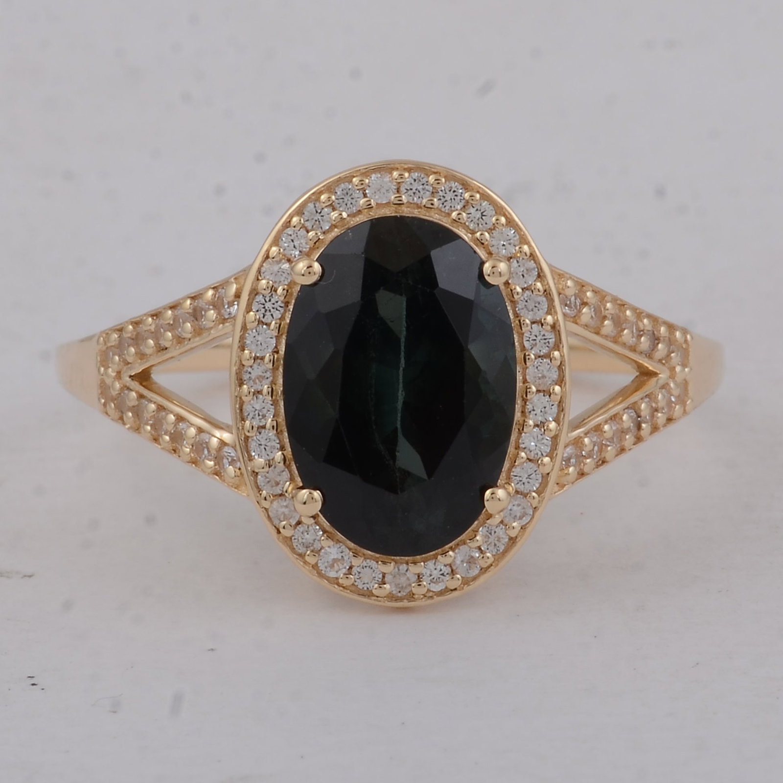 2.49 Ct Oval Tourmaline 9K Gold Ring: 2.49 Total Carat Tourmaline 9K Gold Ring Specifications: Total Weight 2.57 g Center Gemstone Tourmaline Gemstone Carat Weight 2.27 Carats Gemstone Measurements 10X7X5 mm Additional Gemstones White Sap