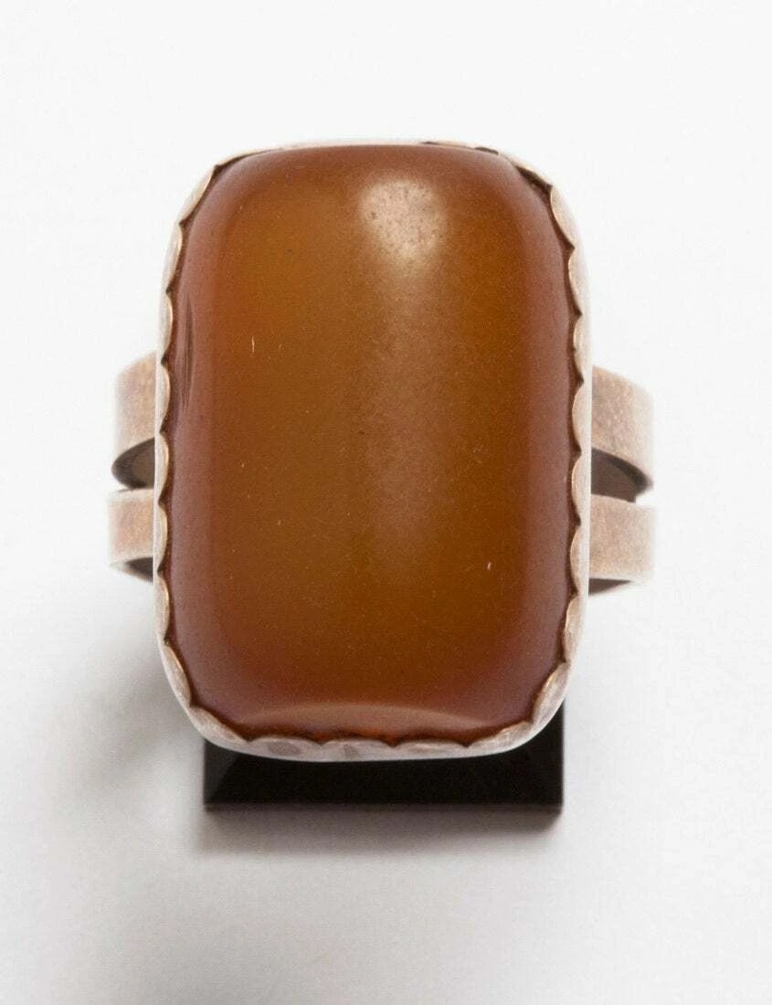 Hand Made Artisan Sterling Silver Butterscotch Amber Ring: Title:Hand Made Artisan Sterling Silver Butterscotch Amber Ring Description:Handmade, unmarked sterling silver and amber ring. Amber cabochon measures 23 mm's by 16 mm's. Circa 1980's. Weighs, 6.5