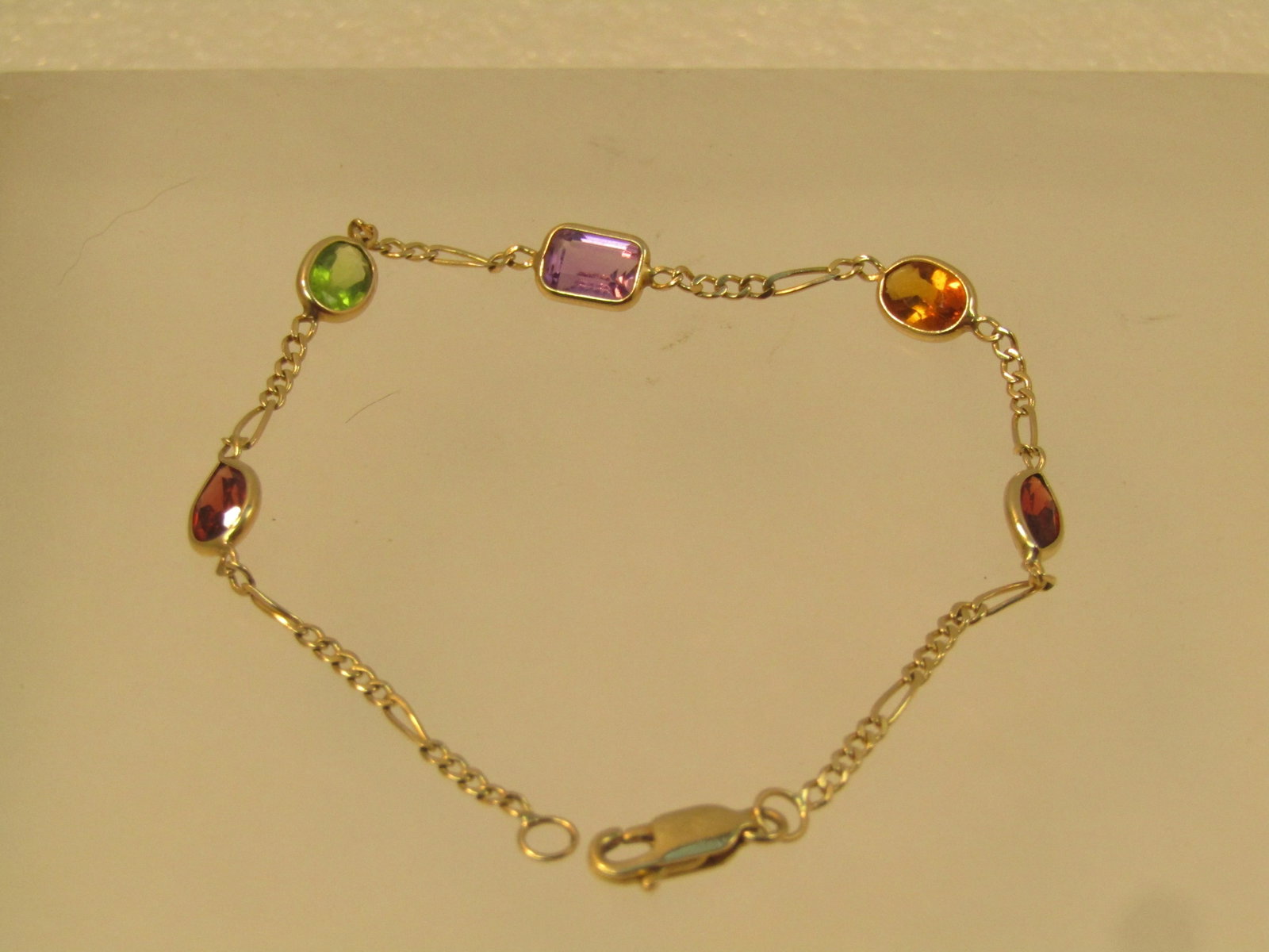 Vintage 14kt Mixed Gemstone Bracelet, 7.25m, 1980's: Title:Vintage 14kt Mixed Gemstone Bracelet, 7.25m, 1980's Description:Vintage 14kt Mixed Gemstone Bracelet, 7.25m, 1980's. 14kt yellow gold, marked on clasp and tested. Weight is appx. 2.76 grams. It 