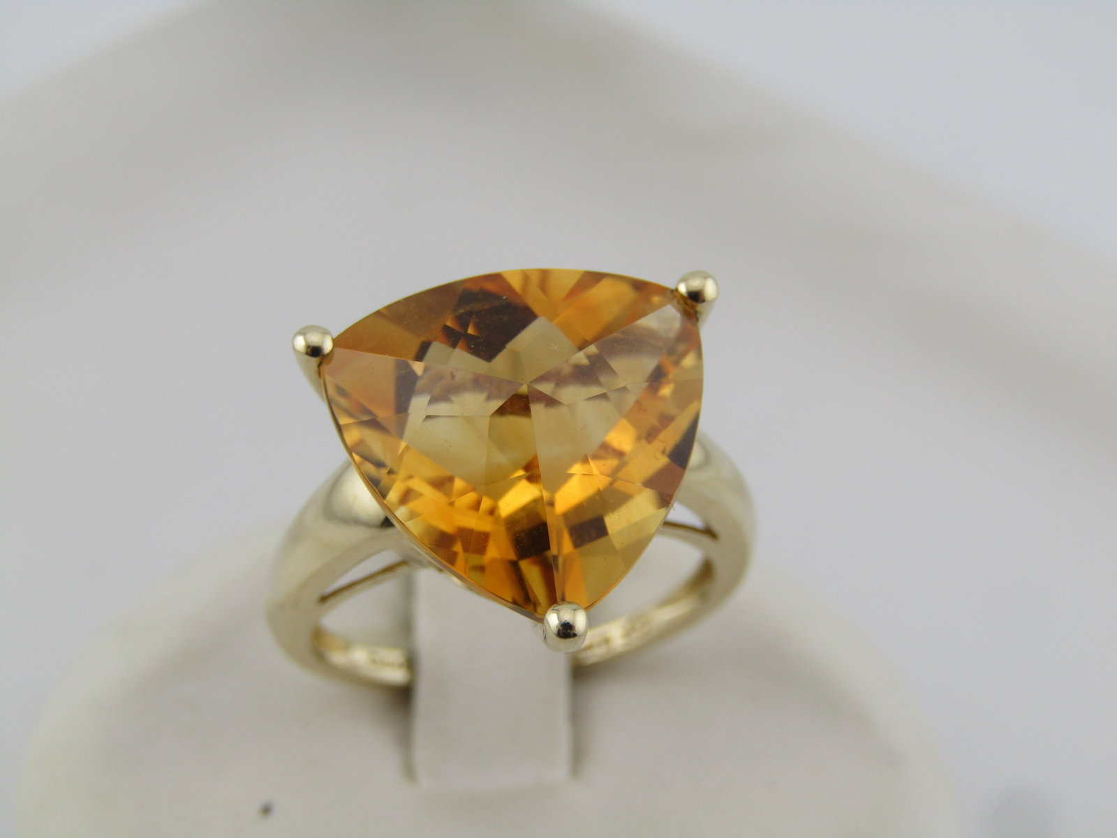10kt Citrine Triangular Cut Ring, Appx. 10 TCW, Sz. 6.25, 1990's and After: Title:10kt Citrine Triangular Cut Ring, Appx. 10 TCW, Sz. 6.25, 1990's and After Description:10kt Citrine 13mm Triangular Cut Ring, Appx. 10 TCW, Sz. 6.25, 1990's and After is the estimated age. Trill
