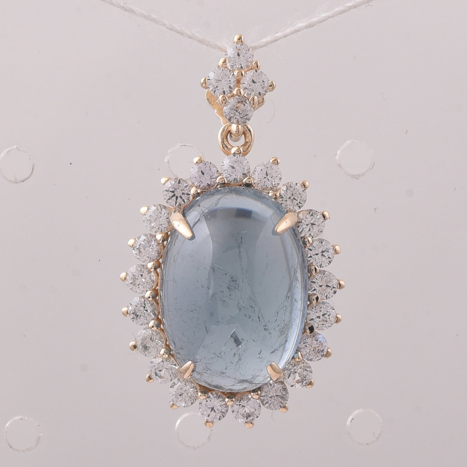 9.22 Ct Oval Tourmaline 9K Gold Pendant: 9.22 Total Carat Tourmaline 9K Gold Pendant Specifications: Total Weight 3.072 g Center Gemstone Tourmaline Gemstone Carat Weight 8.14 Carats Gemstone Measurements 14X10X6.70 mm Additional Gemstones W