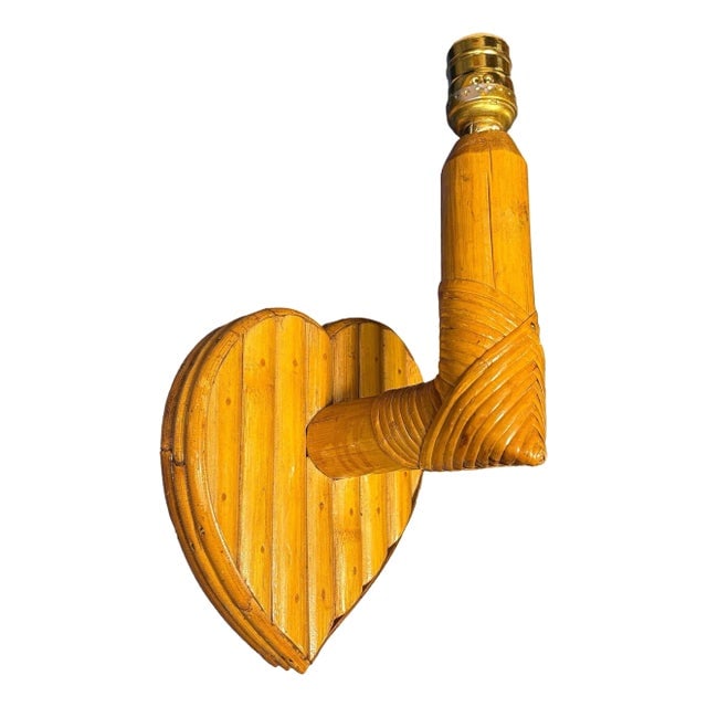 Bespoke Mid-Century Split Rattan Heart Shaped Wall Sconce: Title: Bespoke Mid-Century Split Rattan Heart Shaped Wall Sconce Description: This beautifully restored Custom-made bespoke rattan heart-shaped sconce exudes warmth, blending style and vintage charm w