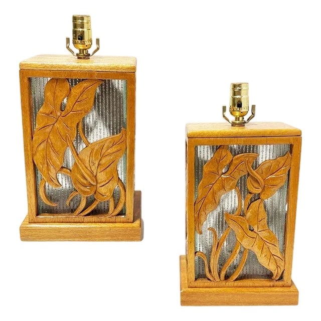 1960s Post War Carved Mango Wood Tropical Mid Century Table Lamp: Title: 1960s Post War Carved Mango Wood Tropical Mid Century Table Lamp Description: A striking pair of mid-century table lamps hand made in Honolulu, Hawaii featuring beautifully carved wood panels w