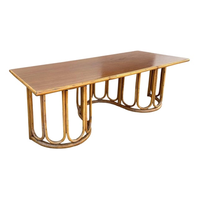 1940s Restored Rattan and Mahogany Coffee Table with Wavy Base: Title: 1940s Restored Rattan and Mahogany Coffee Table with Wavy Base Description: This beautifully restored Paul Frankl-inspired rattan blends vintage charm with modern comfort. This restored rattan 