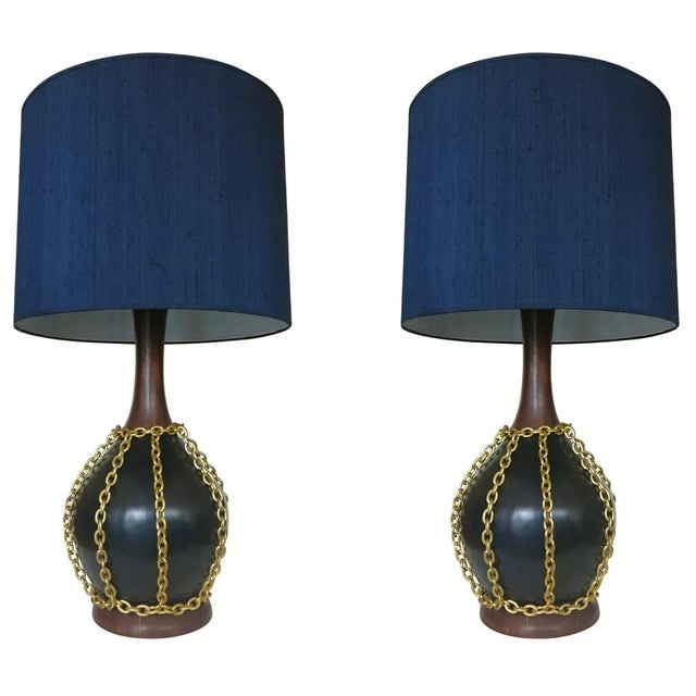 1950s Mid-Century Pottery Gold Tone Chain Lamps - Pair: Title: 1950s Mid-Century Pottery Gold Tone Chain Lamps - Pair Description: Made circa 1960, this large pair of pottery lamps each feature a black and wood grain finish with a unique decorative
