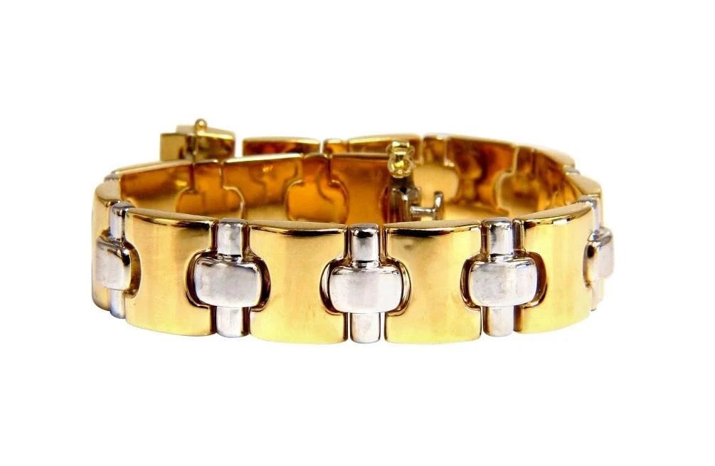 18 Karat Yellow Gold Wide Caliber Bracelet 1990s Nostalgia**: Title: 18 Karat Yellow Gold Wide Caliber Bracelet 1990s Nostalgia** Description: 18 Karat Yellow Gold Wide Caliber Bracelet 1990s Nostalgia** $6,000.00 PRODUCT DESCRIPTION 90's Nostalgia Deco