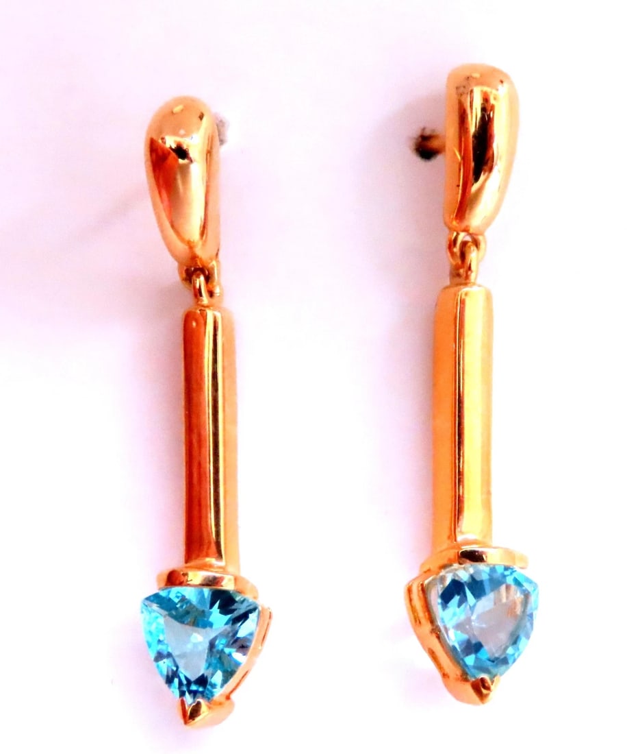 Natural Trilliant Swiss Blue Topaz Dangle Earrings 14kt Gold 12617**: Title: Natural Trilliant Swiss Blue Topaz Dangle Earrings 14kt Gold 12617** Description: Natural Trilliant Swiss Blue Topaz Dangle Earrings 14kt Gold 12617 $450.00 PRODUCT DESCRIPTION trilliant blue t