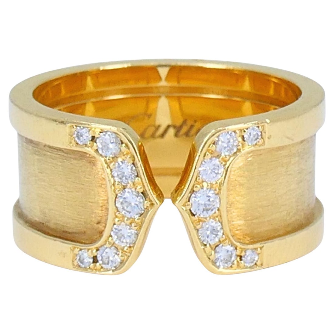 Cartier C de Cartier 18k Yellow Gold Diamond Band Ring: This elegant Cartier C de Cartier ring is crafted in rich 18k yellow gold and showcases the house’s refined approach to modern design. The sculptural open C-motif is finished with a soft brushed