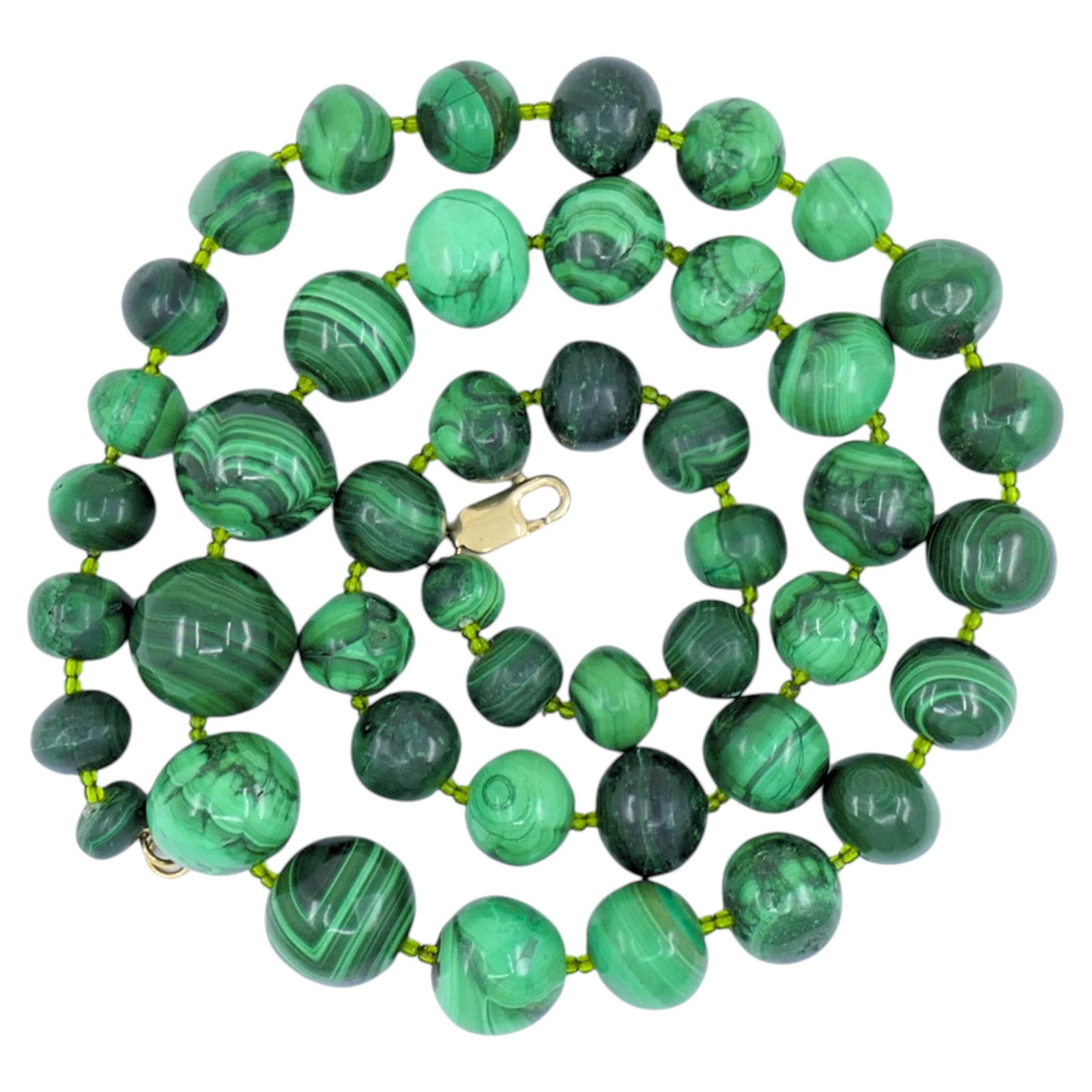 Vintage Malachite Necklace 14k Gold Clasp: A vintage malachite necklace with a 14k gold clasp. The necklace features a full strand of polished malachite beads in a rich range of green tones, from deep forest to lighter, banded hues. Each bead 