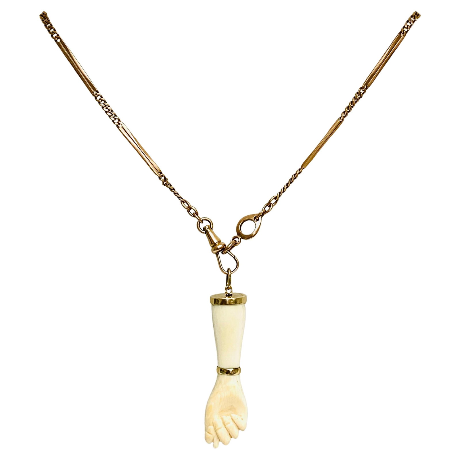 Victorian 10k Gold Chain Figa Pendant Necklace: Materials: 10K Rose Gold Chain, 14K Pendant Weight: 17 grams Gemstone: Bakelite Measurement: Pendant - 2" x 1/2" Chain - 20" long Hallmarks: 14K, 585 ITEM DETAILS: An antique 10k chain necklace with a