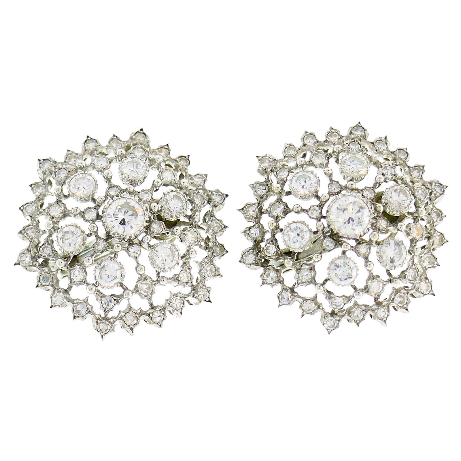 Buccellati Diamond White Gold Earrings: Classy and timeless ear clips created by Buccellati in Italy in the 1960s. Feminine, wearable and chic, the earrings are a great addition to your jewelry collection. Made of 18 karat white gold and