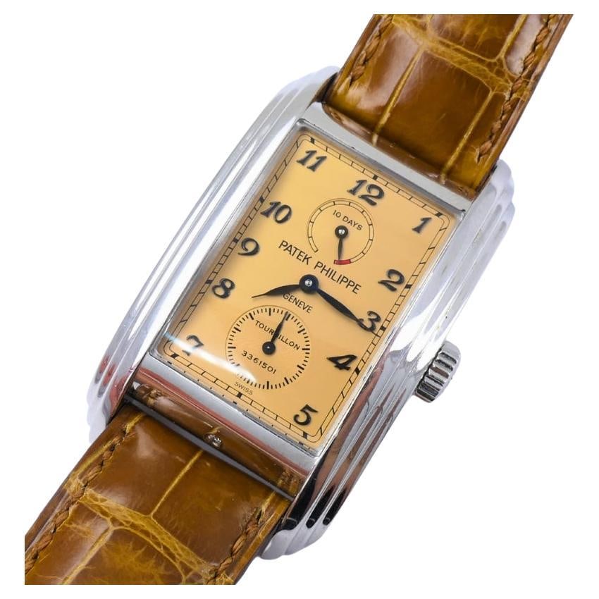 Patek Philippe 5101P 10-Day Tourbillon Platinum Watch Original Strap: The Patek Philippe Reference 5101P 10-Day Tourbillon is a masterpiece of mechanical sophistication and understated elegance. Crafted in solid platinum, its distinctive rectangular case features Art
