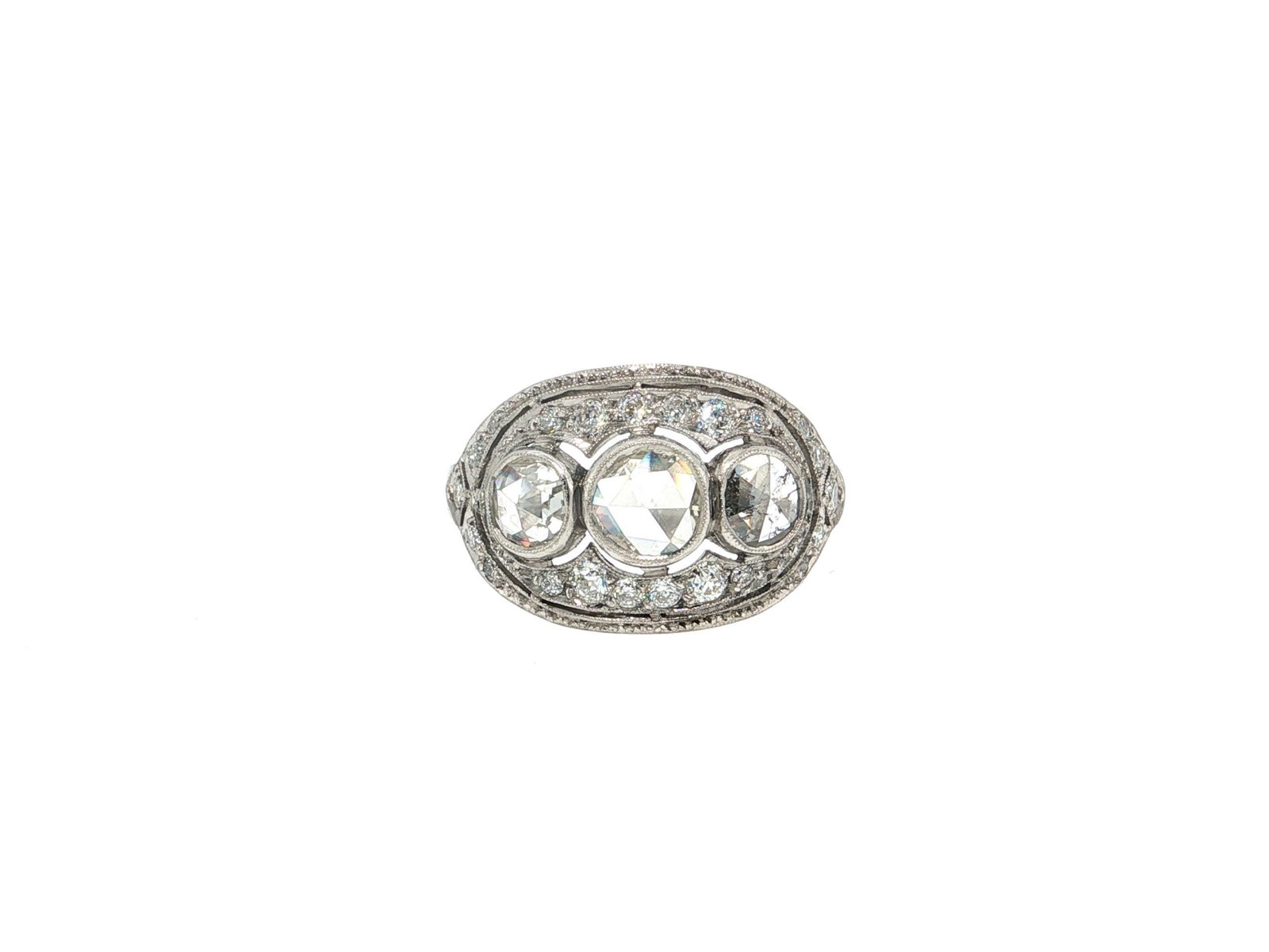 Vintage Rose-Cut Diamond Filigree Trio Cocktail Ring in Platinum: An exquisite Edwardian-style platinum cocktail ring featuring a trio of round rose-cut diamonds of I/J color and SI1 clarity that weigh 0.75ctw. in milgrain-edged bezels. This ornate design is accente