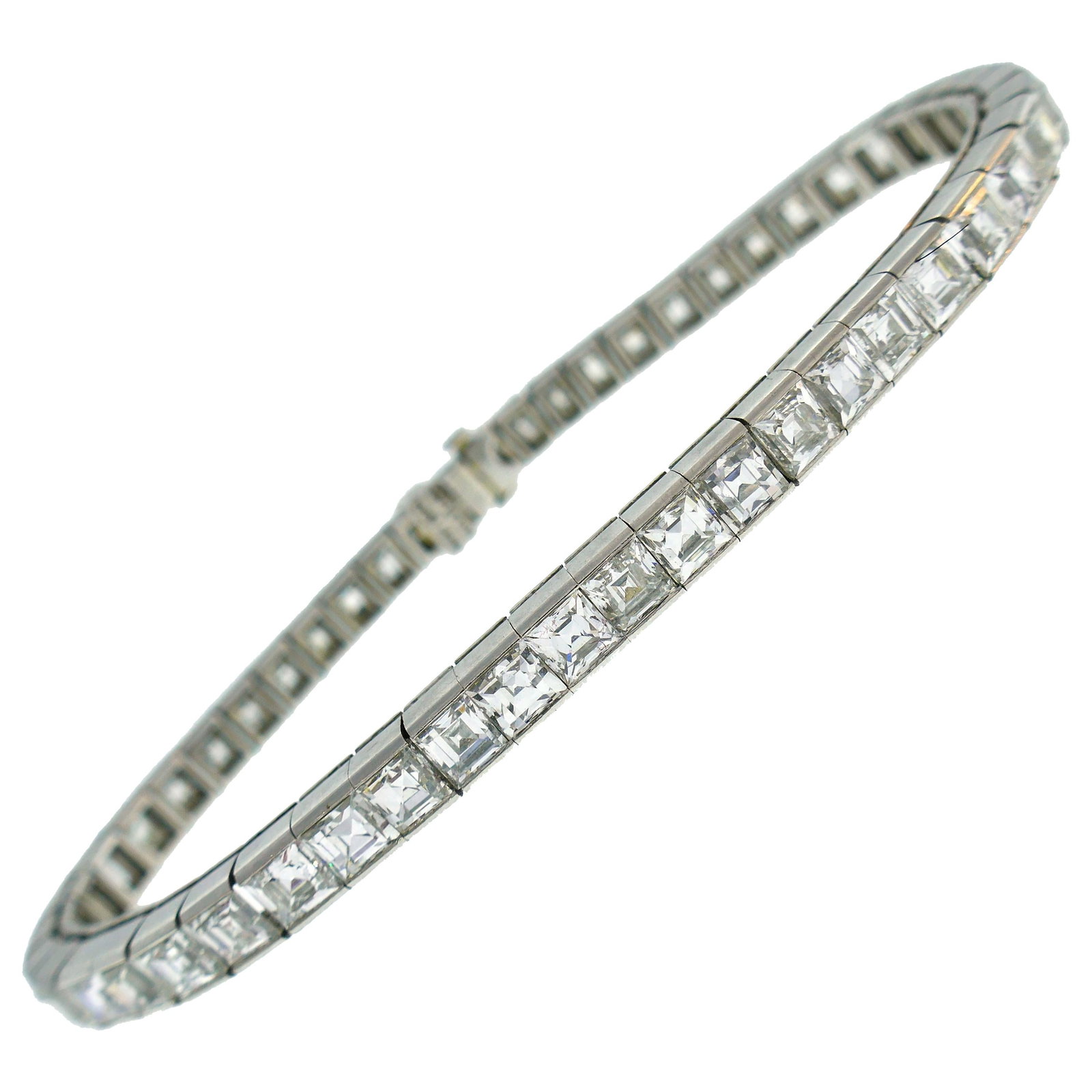 Tiffany & Co. Diamond Platinum Tennis Line Bracelet, 1950s: Stunning diamond and platinum tennis bracelet created by Tiffany & Co. in the 1950s. The bracelet features forty-four perfectly selected matching square step cut diamonds of H-I color, VS clarity and 