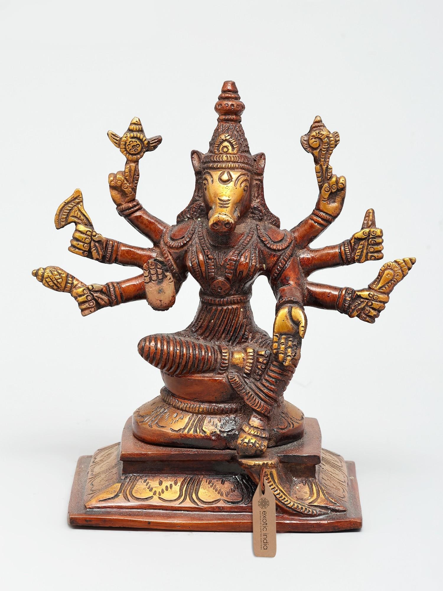 7" Eight Armed Sitting Goddess Varahi | Brass Statue: Embodiment of Divine Power and Protection This exquisite brass statue captures the formidable and benevolent form of Goddess Varahi, one of the most powerful aspects of the Devi. She is depicted in a