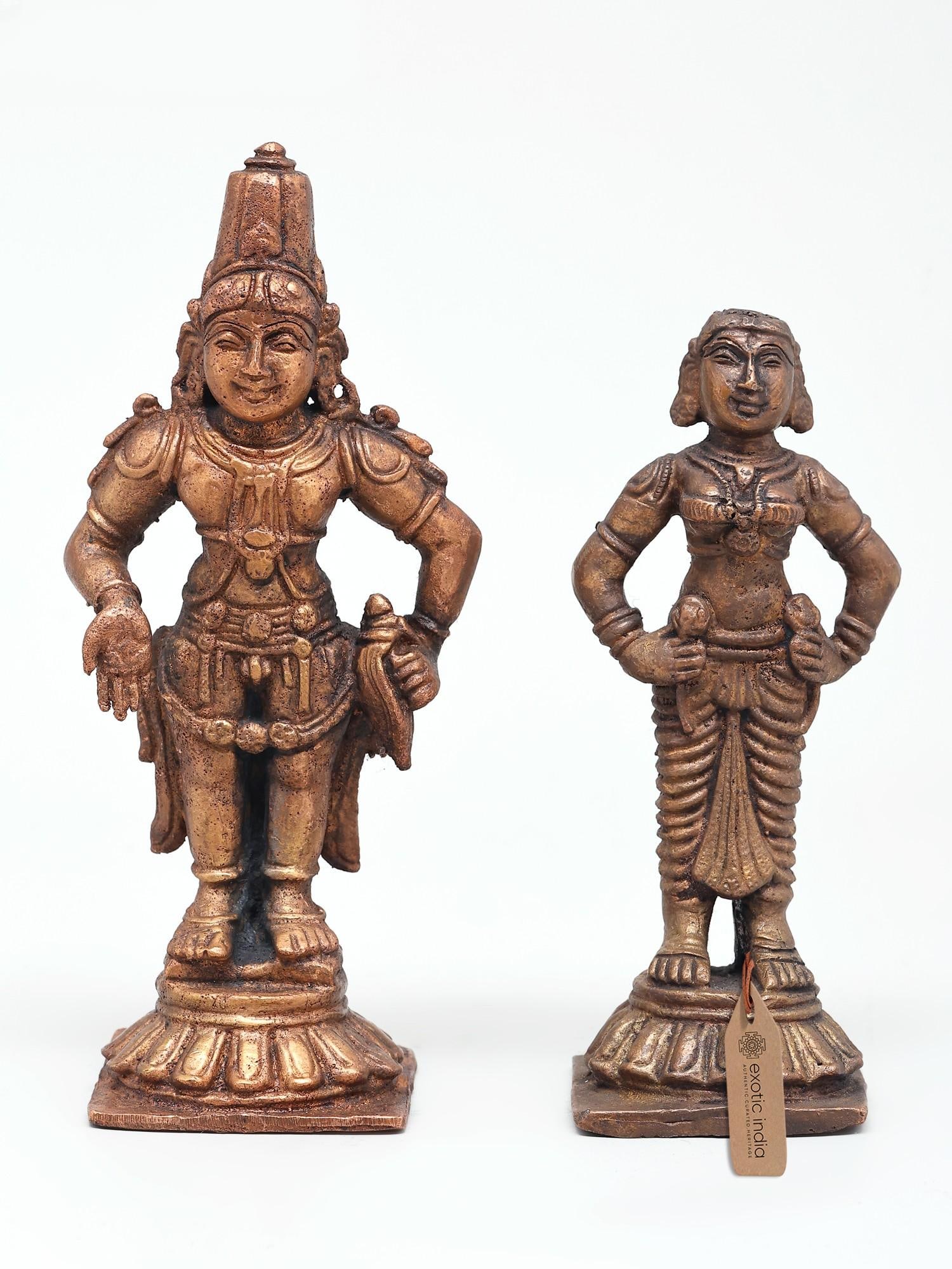 6" Standing Lord Vitthal (Panduranga) with Rukmini | Set of 2 Copper Statues: The Divine Presence of Panduranga and Rukmini This exquisite set of two copper statues captures the beloved forms of Lord Vitthal, also known as Panduranga, and his consort, Goddess Rukmini. Standing
