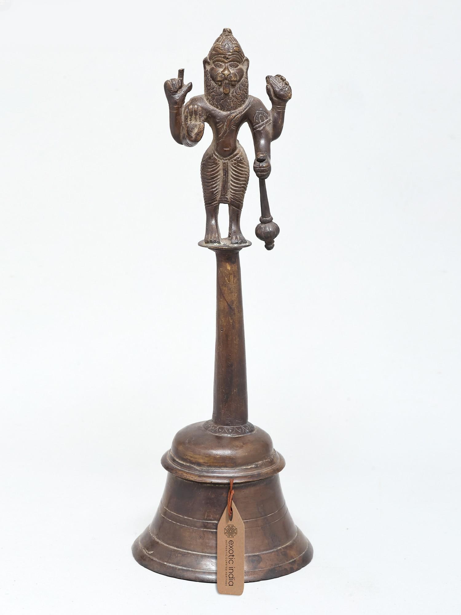 12" Lord Narasimha Bell in Bronze: A Divine Herald of Protection and Strength This exquisite bronze bell is more than just a ritualistic instrument; it is a powerful embodiment of Lord Narasimha, the man-lion avatar of Lord Vishnu. Cra