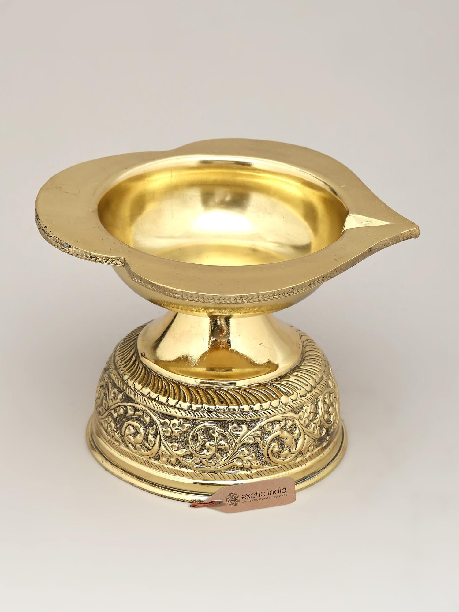 7" Superfine Brass Diya (Lamp) | Ritual Item: A Beacon of Divinity: The Ornate Brass Diya Illuminate your sacred spaces and elevate your spiritual practices with this exquisite superfine brass diya. More than just a lamp, this diya is a conduit t