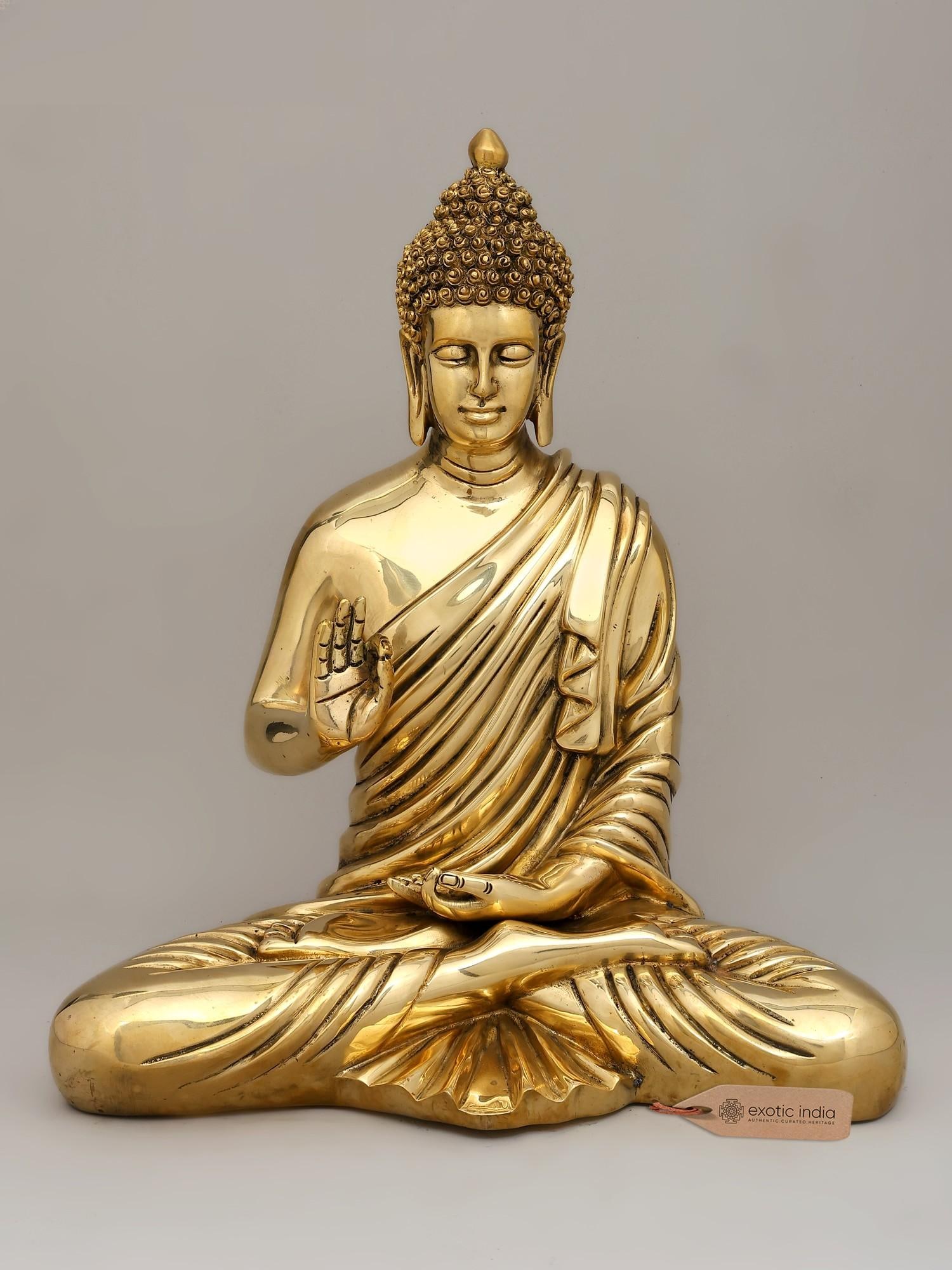 15" Sitting Lord Buddha in Blessing Gesture | Brass Statue: A Beacon of Serenity and Enlightenment Invite the profound peace and wisdom of the awakened one into your sanctuary with this exquisite brass statue of Lord Buddha. Seated in the meditative lotus post