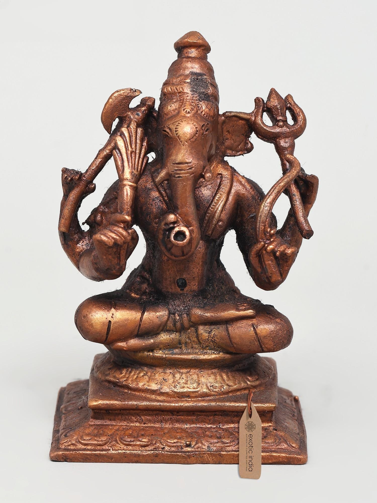 4" Small Bhagawan Ganesha | Copper Idol: The Remover of Obstacles: A Divine Copper Likeness This exquisite copper idol portrays Bhagawan Ganesha, the beloved elephant-headed deity revered as the remover of obstacles and the god of