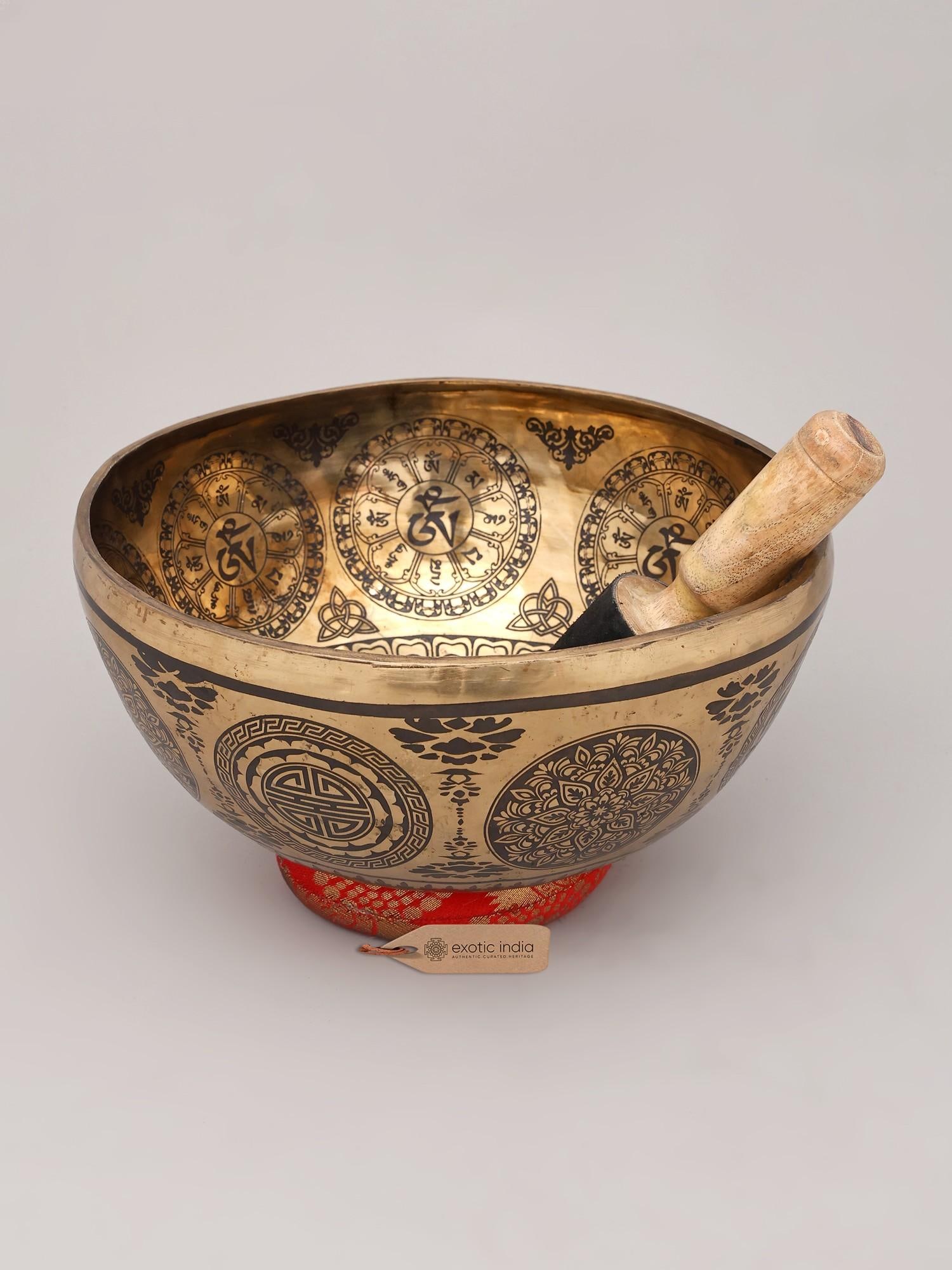 11" Tibetan Healing Engraved Bronze Singing Bowl | Handmade | Made in India: The Resonance of the Himalayas Immerse yourself in the ancient art of sound healing with this exquisite bronze singing bowl, meticulously handcrafted in India. This is not merely an instrument; it is