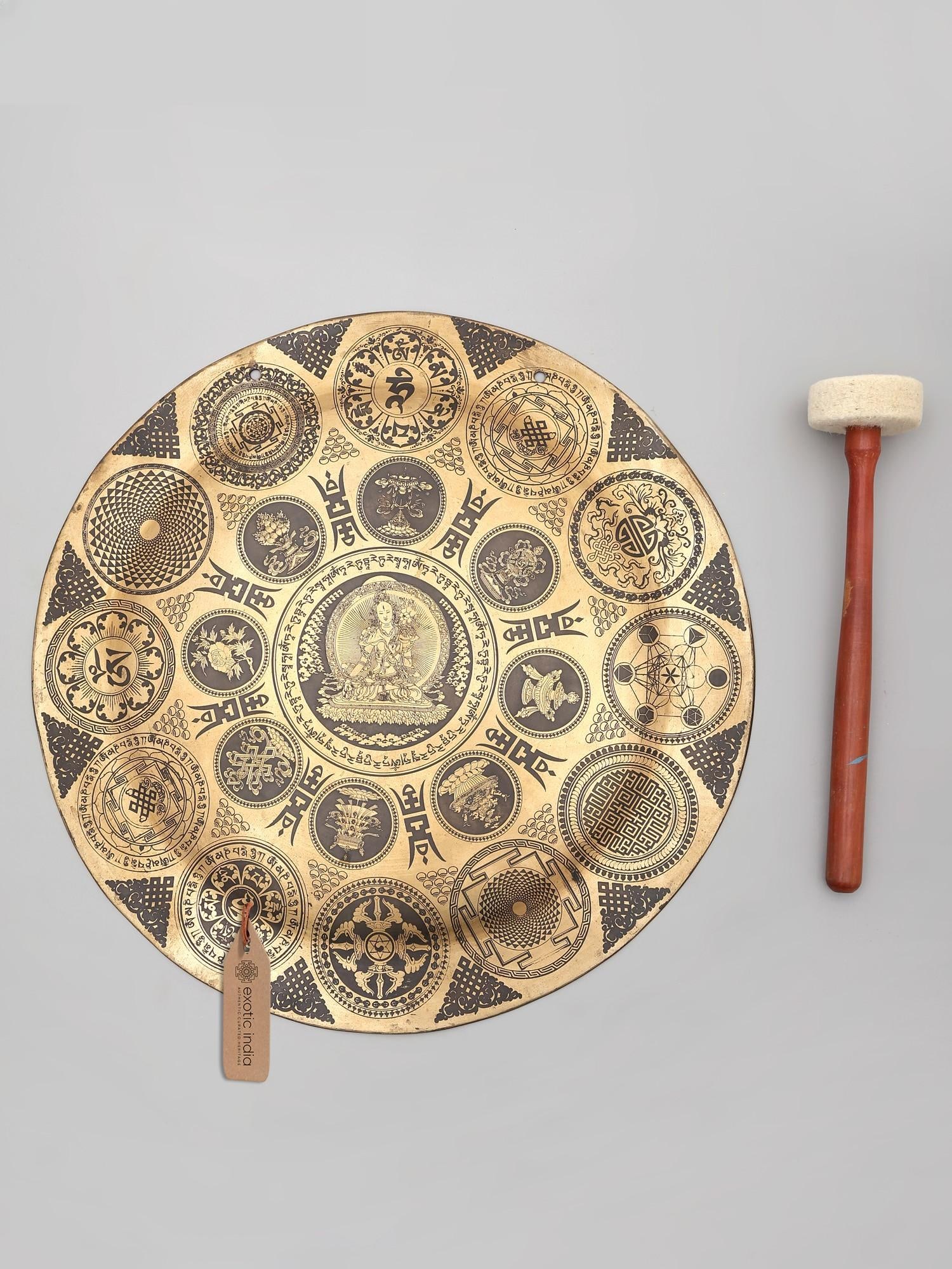 17" Buddhist Deity Seated in The Center of Peace and Tibetan Bronze Gong with Wood Beater | Made in: A Symphony of Serenity: The Tibetan Bronze Gong of Inner Peace Immerse yourself in a realm of profound tranquility with this exquisite Tibetan bronze gong, a sacred artifact meticulously crafted in