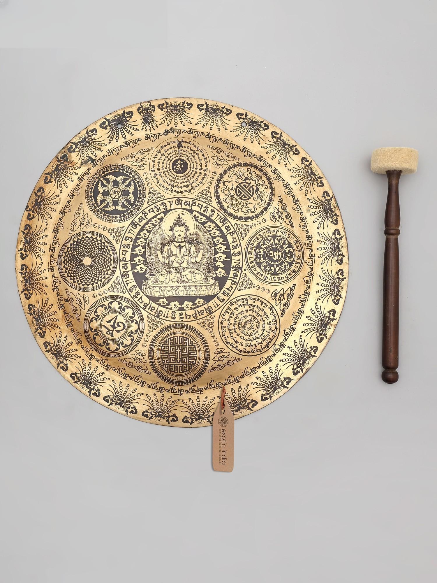 17" Tibetan Bronze Gong with Wood Beater, Mantra and Mandala Etchings | Made in India: Echoes of the Himalayas: A Sacred Bronze Gong This magnificent 17-inch Tibetan bronze gong is more than just a musical instrument; it is a portal to spiritual practice and a testament to the rich
