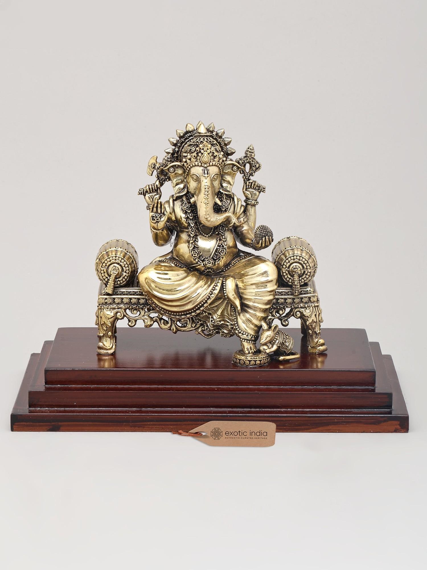 9" Superfine Lord Ganapati Seated on Asana with Wood Base | Brass Statue: 9" Superfine Lord Ganapati Seated on Asana with Wood Base | Brass Statue Reserve: $326.00 Shipping: Domestic: Shipping rates are determined by destination International: Foreign shipping rates are det